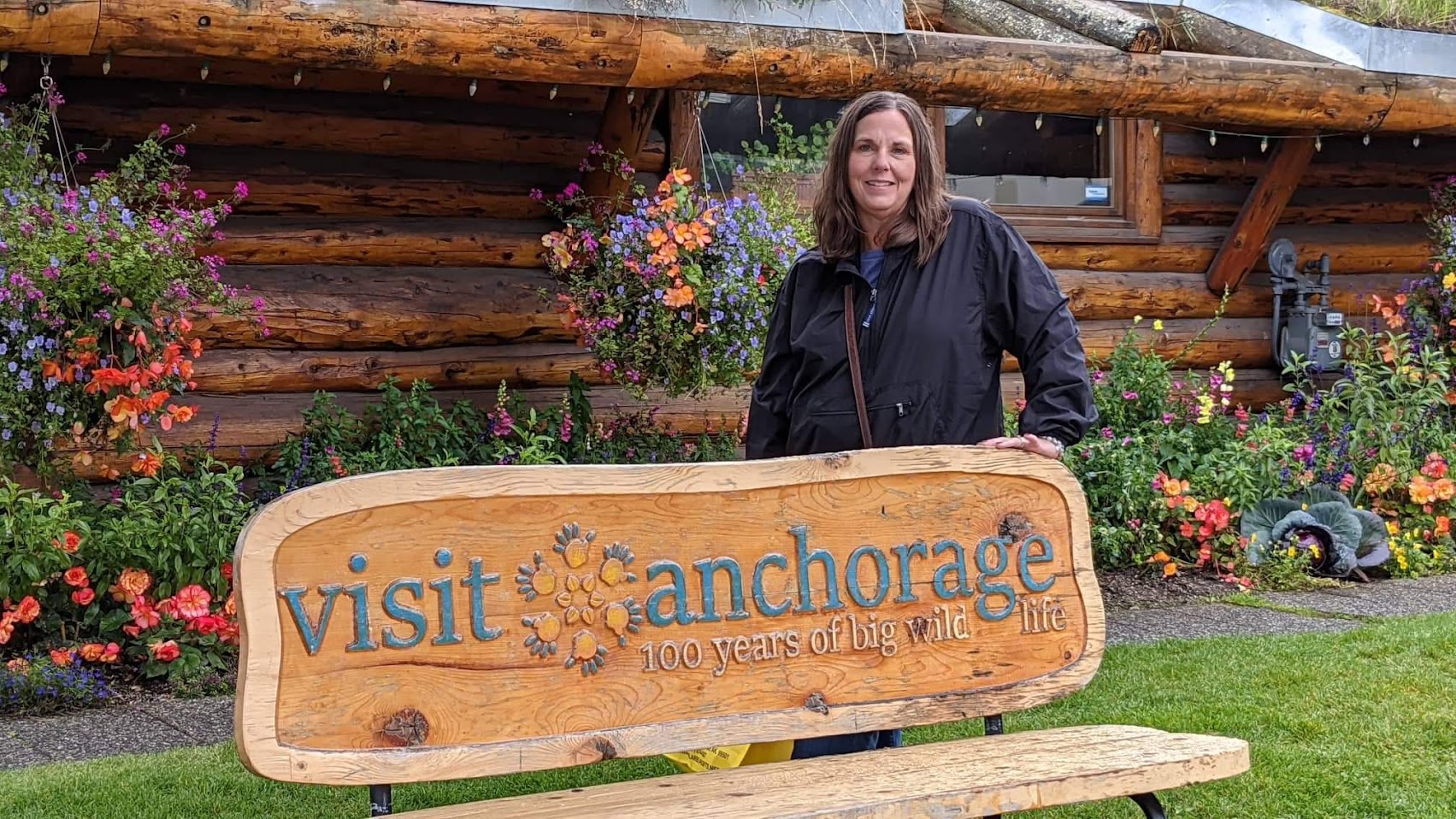 Cathy with Visit Anchorage sign